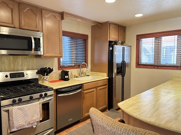 Fully equipped kitchen with stainless appliances